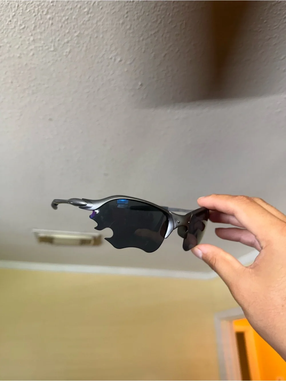 Silver Frame Sunglasses with Dark Lenses Oakley